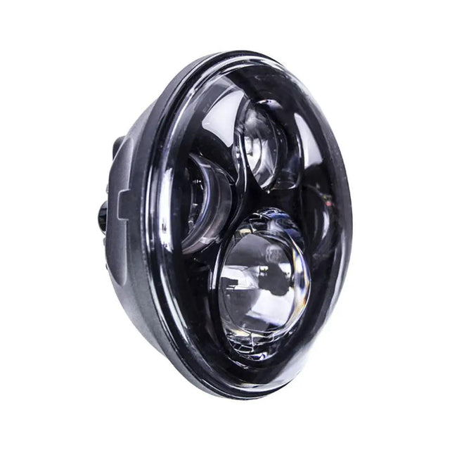 Angled view of a round black motorcycle headlight with projector lenses and partial halo
