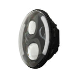 Angled round headlight with two projector lenses and a curved white accent strip