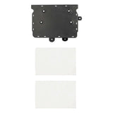 Black amplifier mounting plate beside two rectangular white pads
