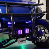 Blue and purple accent lights installed on a touring motorcycle, with green light beneath it