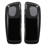 Top view of two glossy black saddlebag lids with mesh speaker grilles