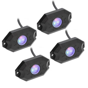 Four black rock-light pods with purple-lit lenses and attached leads