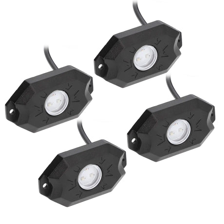 Four black rock-light pods with clear round lenses, mounting holes and attached cables