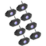 Eight black rock-light pods with purple-lit lenses and attached leads