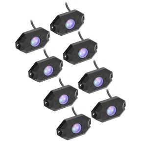 Eight black rock-light pods with purple-lit lenses and attached leads