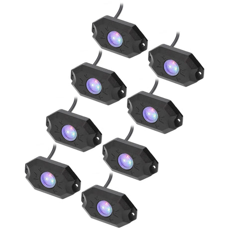Eight black rock-light pods illuminated in blue and purple