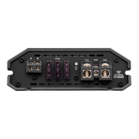 Amplifier terminal panel with speaker outputs, three fuses, power and remote connections, and a clip indicator