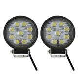 Front view of two unlit round nine-LED lamps with mounting brackets and leads