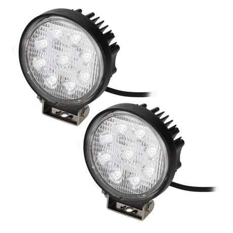 Pair of round LED driving lights with bright white lenses, finned housings and mounting brackets
