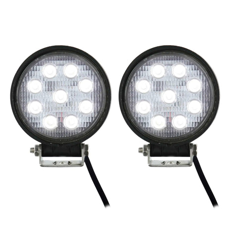 Two round driving lights illuminated white, showing nine LEDs in each light