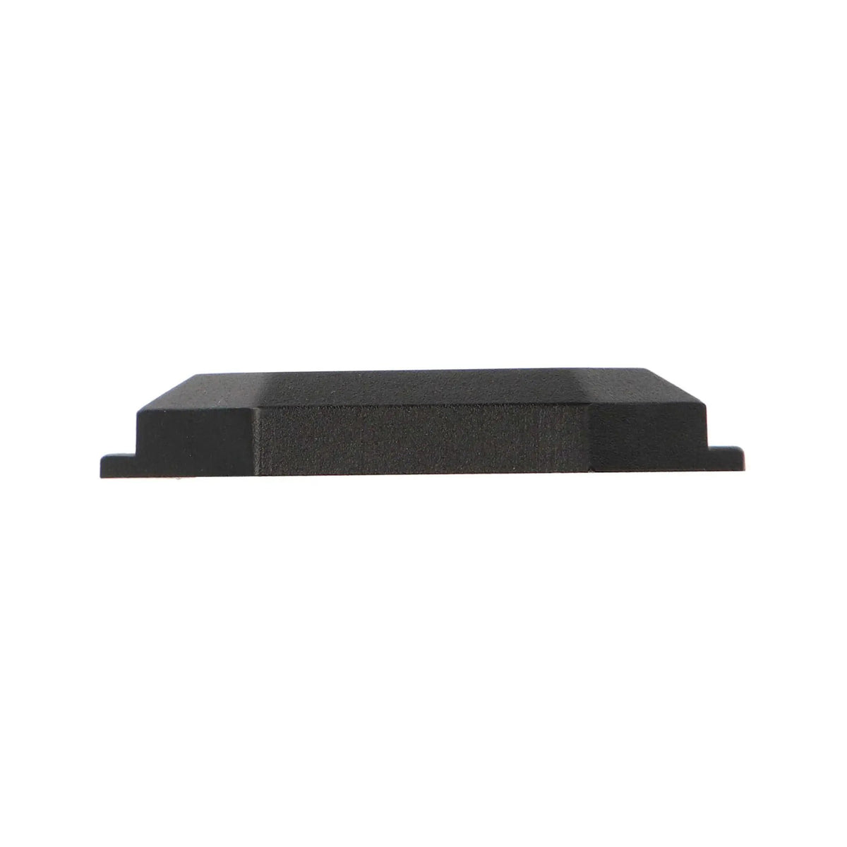 Side profile of a low-profile black rock-light pod