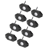 Eight black rock-light pods with unlit lenses and attached leads