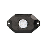 Front view of a black rock-light pod with three LEDs and mounting holes