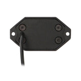 Rear view of a black rock-light pod with screws and an attached lead