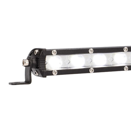 Close-up of an illuminated single-row LED light bar and its end mounting foot