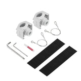 White mounting clamps, safety cables, hex keys, thread-locking tube and black rubber strips laid out