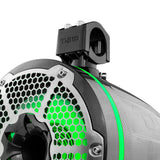 Close-up of a carbon-fiber-patterned tower speaker with green lighting, a silver honeycomb grille and mounting clamp