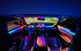 Car interior with multicolored accent lighting across the dashboard, doors and center console