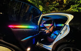 Open rear car door with a rainbow-colored light strip and illuminated cabin