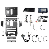 Radio installation components laid out with dashboard panels, mounting brackets, interface modules, wiring harnesses and adapter leads