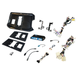 Radio installation components laid out with dashboard panels, brackets, an interface module and wiring adapters
