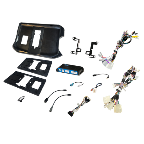 Radio installation components laid out with dashboard panels, brackets, an interface module and wiring adapters