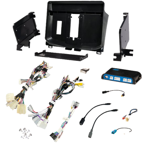 Radio installation components laid out with a dashboard panel, mounting brackets, interface module and wiring adapters