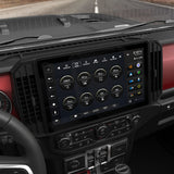 Angled view of an installed Stinger widescreen display showing vehicle gauges above the climate controls