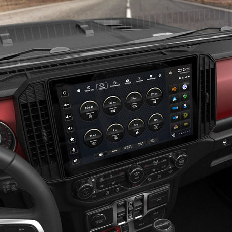 Angled view of an installed Stinger widescreen display showing vehicle gauges above the climate controls