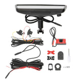 Mirror camera kit laid out with a rear camera, wiring, mounting adapters and screws