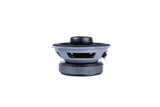 Side of a coaxial speaker, showing its raised tweeter, gray basket and black magnet