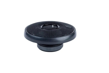 Low-angle view of a round black mesh speaker grille with a central Memphis badge