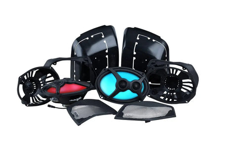 Memphis saddlebag speaker components arranged together, including lid panels, two illuminated speakers and interchangeable grilles