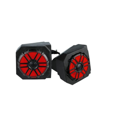 Two angular black speaker pods with red illuminated cones