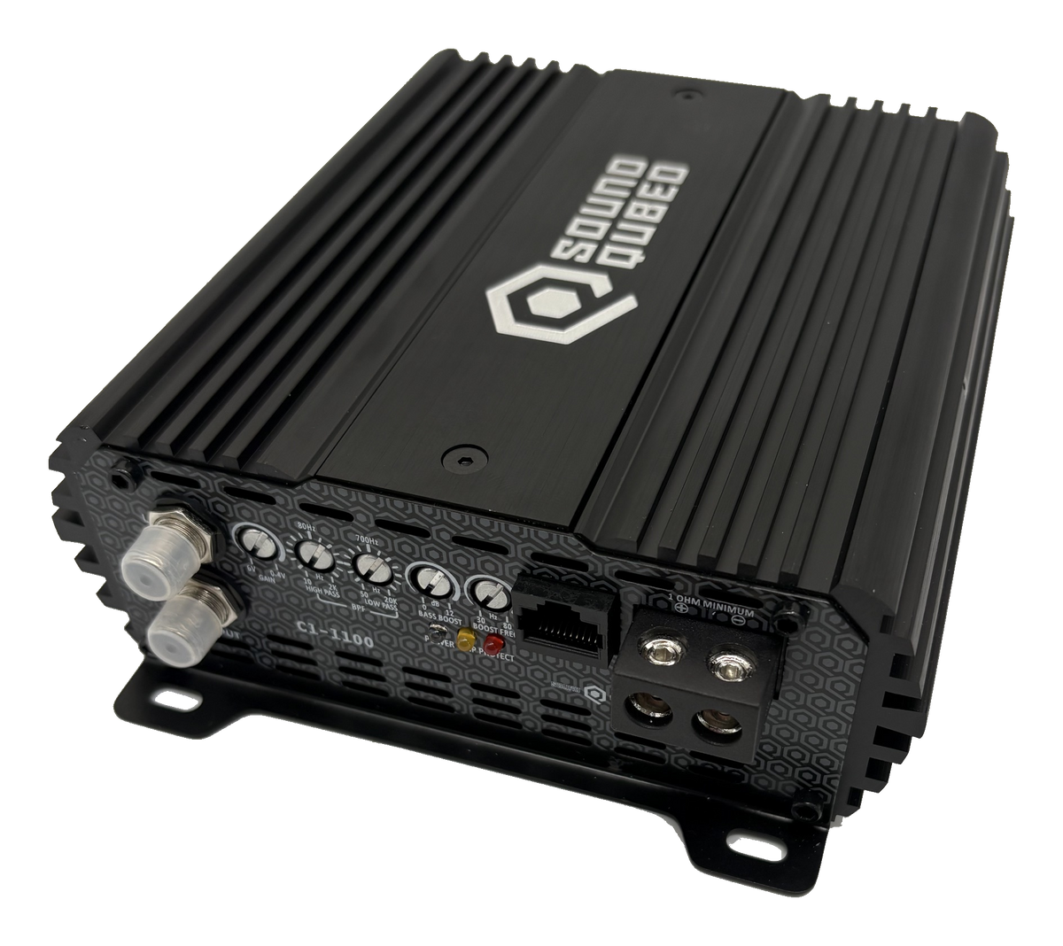 Angled view of a SoundQubed C1-1100 amplifier showing its input jacks, adjustment controls and speaker terminals