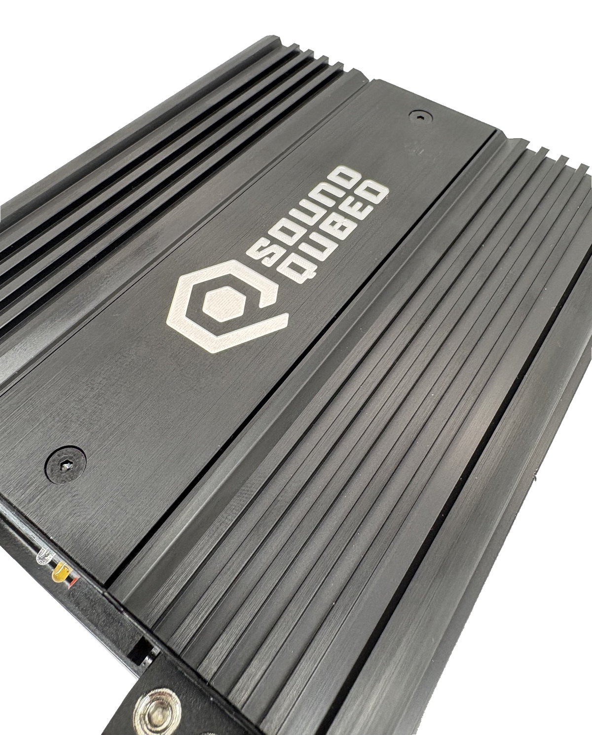 Close-up of a SoundQubed amplifier's brushed top panel and parallel cooling fins