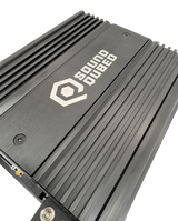 Close-up of a SoundQubed amplifier's brushed top panel and parallel cooling fins