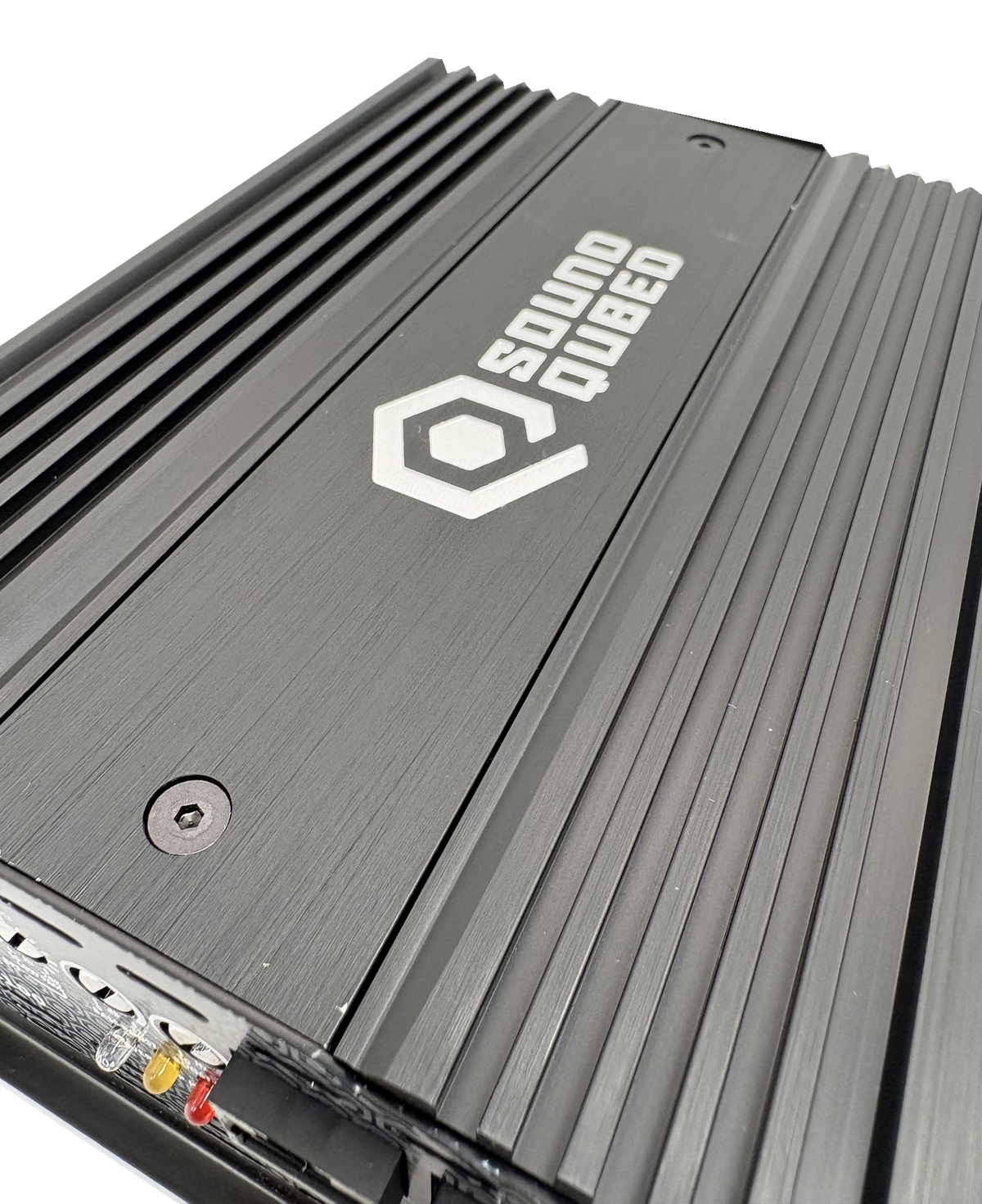 Close-up of a SoundQubed amplifier top showing its logo, recessed screws and parallel cooling fins