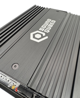 Close-up of a SoundQubed amplifier top showing its logo, recessed screws and parallel cooling fins