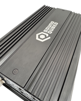 Close angled view of a SoundQubed amplifier's black top panel, white logo and longitudinal cooling fins
