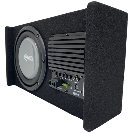Angled underside view of a SoundQubed enclosure showing a gray subwoofer beside the amplifier heat sink and controls