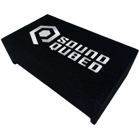 Angled top view of a low-profile black enclosure with a large white SoundQubed logo