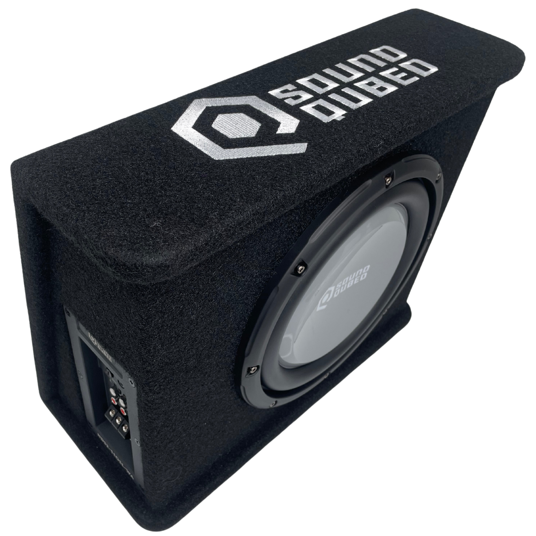 High angled view of a SoundQubed wedge enclosure showing its top logo, subwoofer and recessed side connection panel