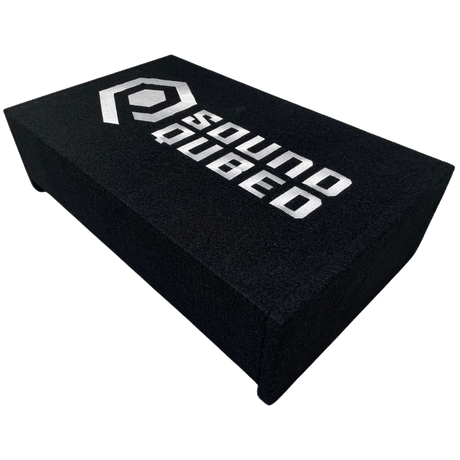 Angled top view of a low black enclosure with the SoundQubed logo and end supports
