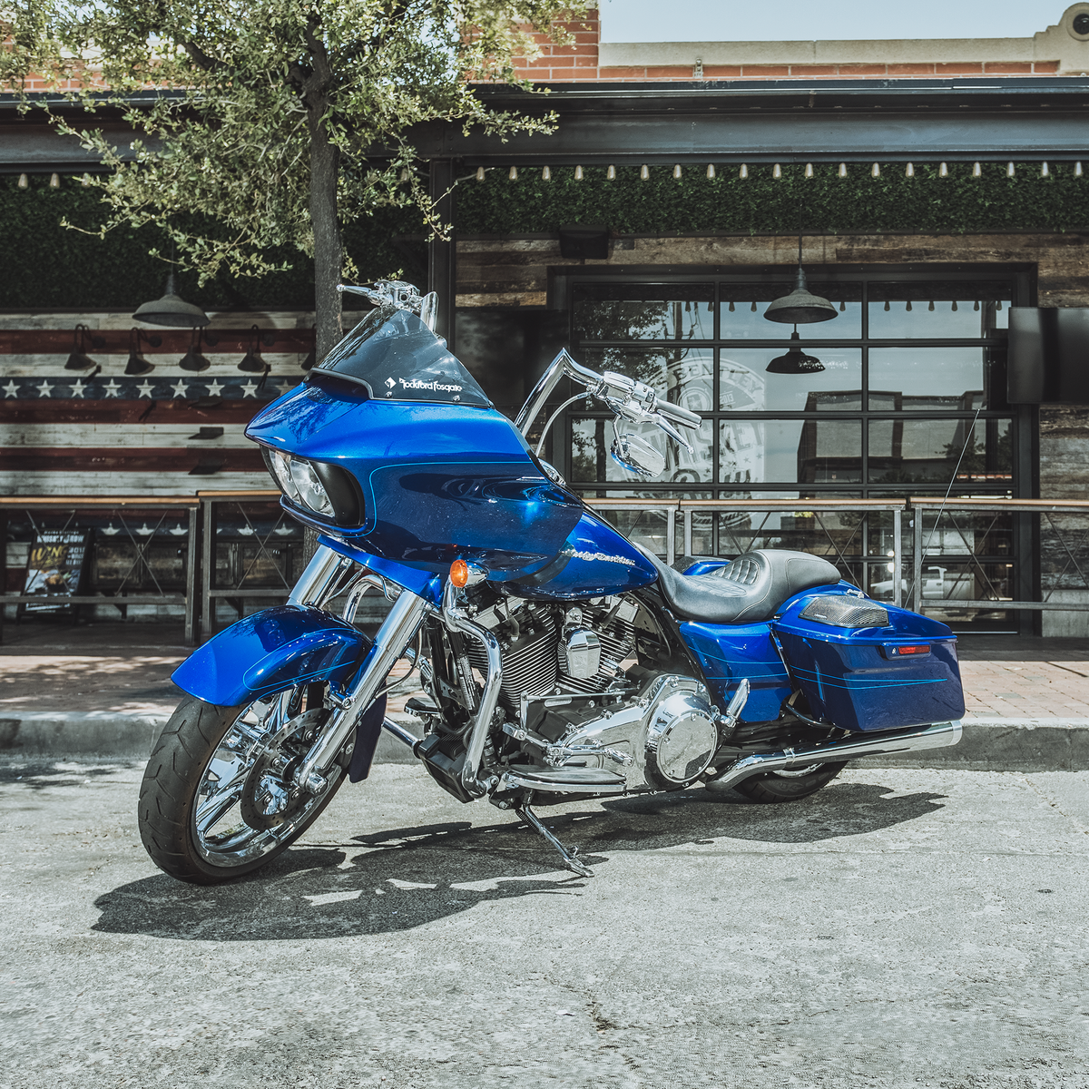 Profile View of Motorcycle Parked on Pavement