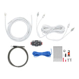 Wiring kit laid out with white and dark cables, RCA cable, fuse holder, connectors and cable ties