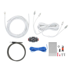 Wiring kit laid out with white and dark cables, RCA cable, fuse holder, connectors and cable ties