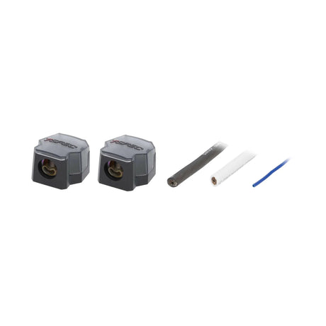 Angled view of two covered power distribution blocks with cable ends and a blue wire
