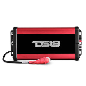 Top view of a red-and-black DS18 amplifier with mounting tabs and attached RCA lead