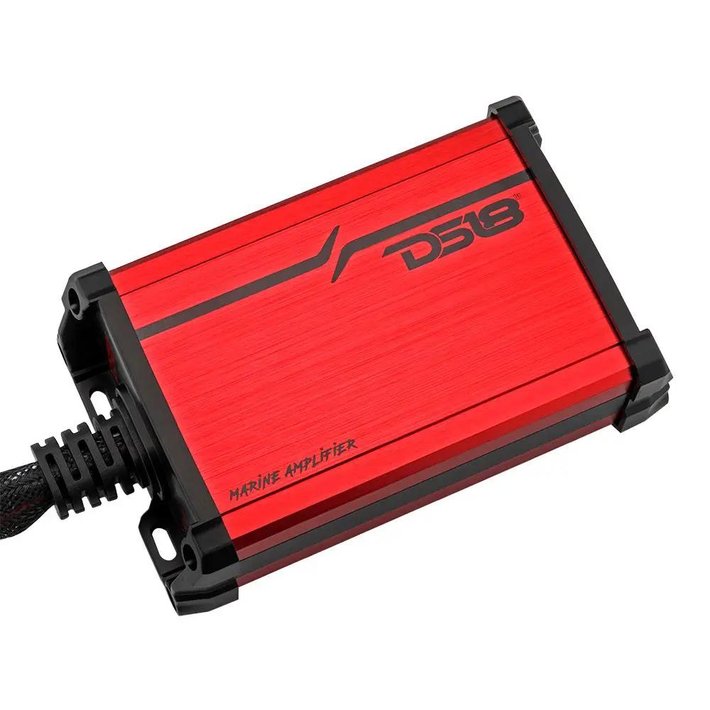 Angled top view of a red DS18 marine amplifier with black end caps, mounting feet and a braided cable